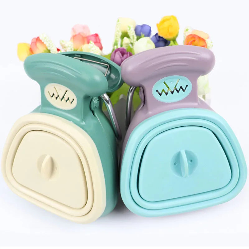 Cream and blue foldable pooper scoopers